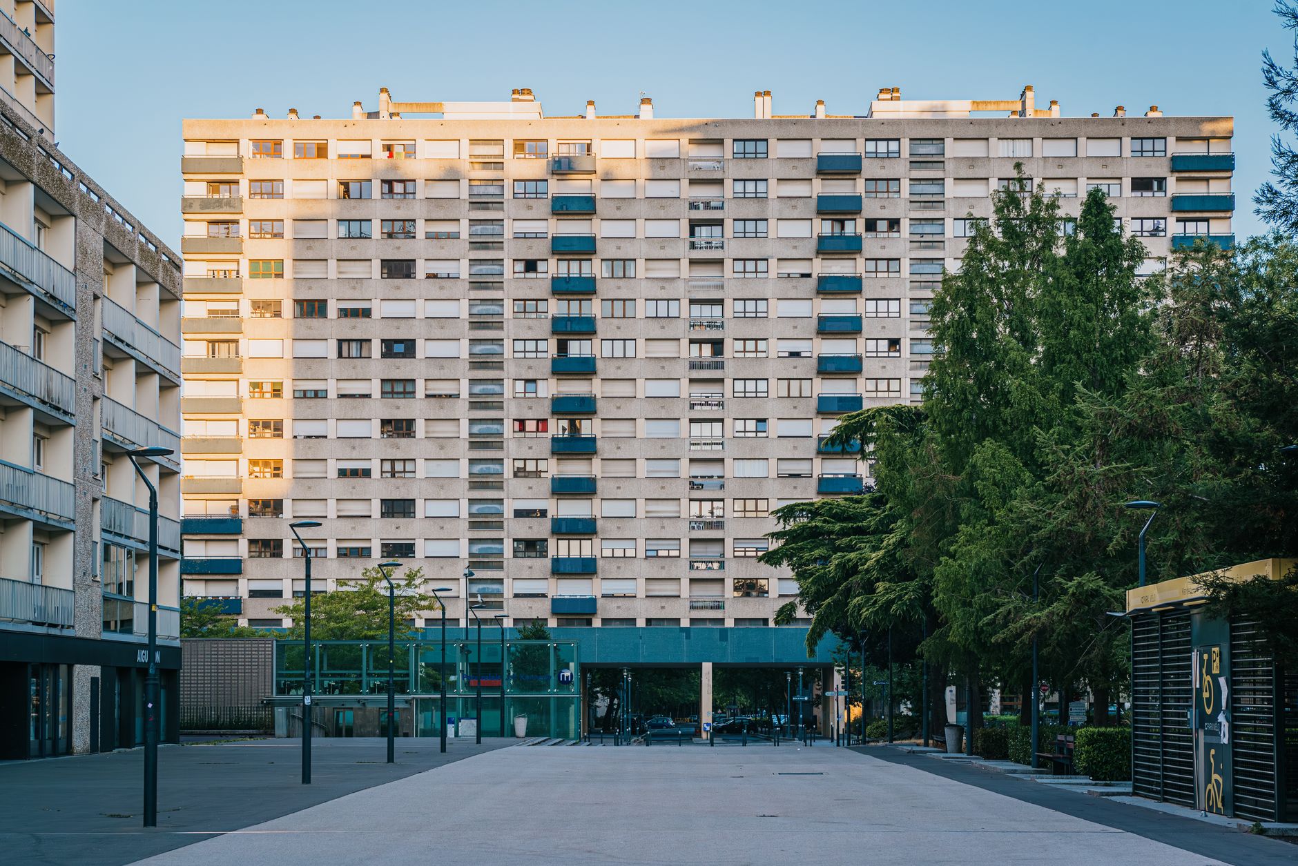 Concrete residential building in Rennes, France, surrounded by greenery.