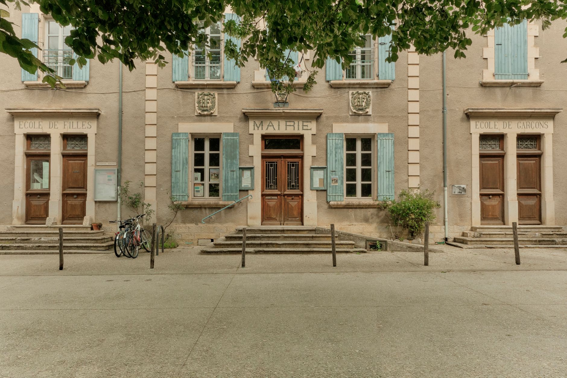Front view of a traditional French town hall in Auvergne-Rhône-Alpes, France, during summer.